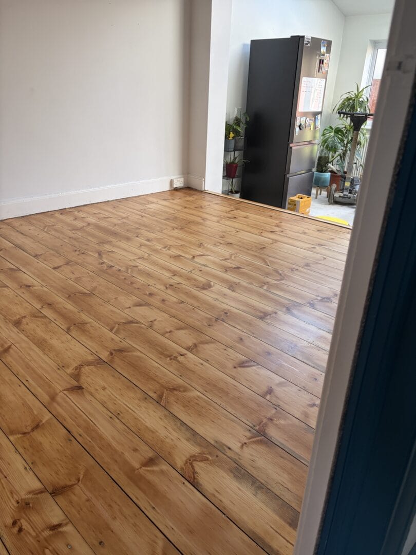 Pine wood floor sanding and refinishing by art of clean in the CB5 area